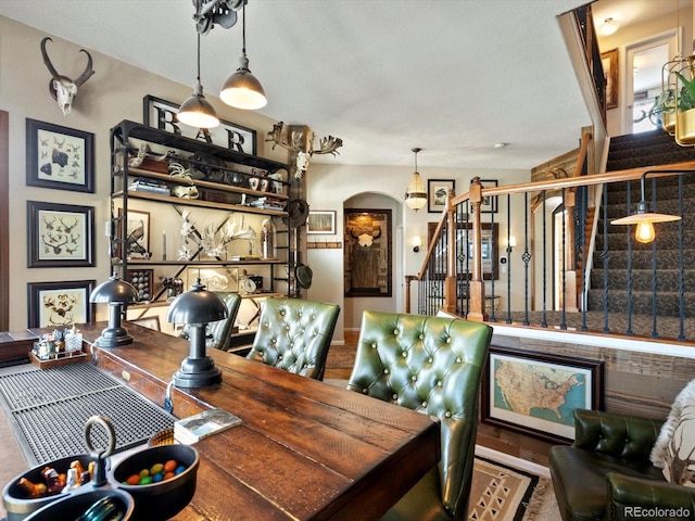 10273 Salida St, Commerce City, CO 80022 - dining space featuring arched walkways and stairs