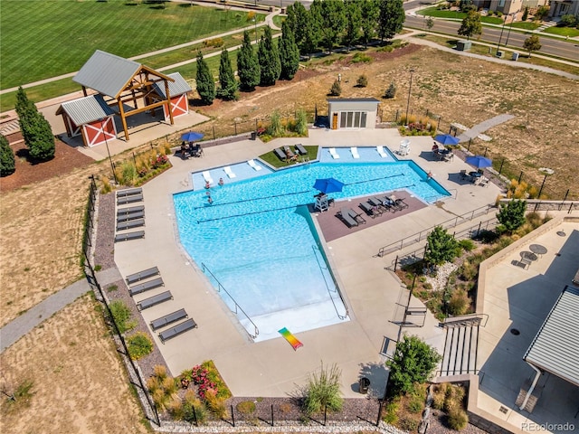 10273 Salida St, Commerce City, CO 80022 - pool with an outdoor structure, fence, and a patio area