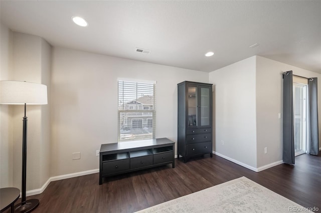 unfurnished bedroom with dark hardwood / wood-style floors