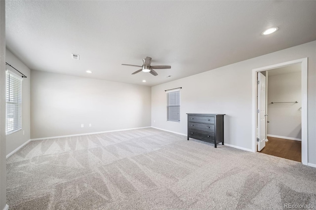 unfurnished bedroom featuring ceiling fan and carpet floors