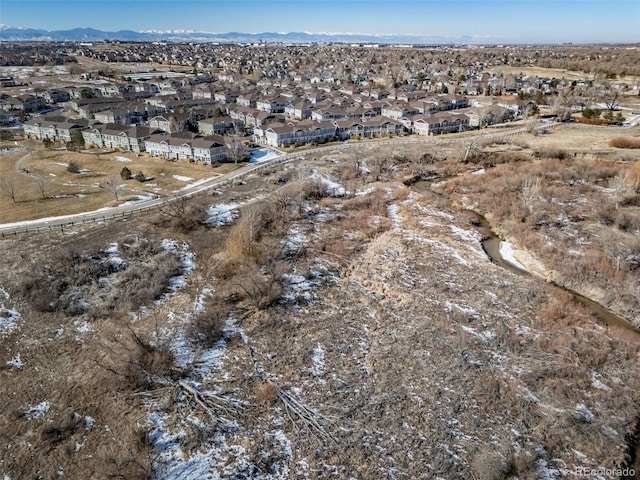 birds eye view of property with a mountain view