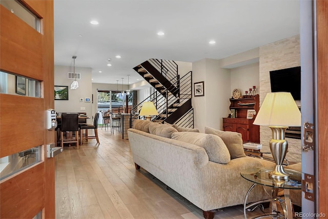 613 Iowa St, Golden, CO 80403 - living area featuring wood-type flooring, stairs, visible vents, and recessed lighting