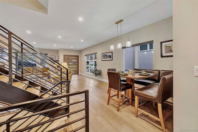 613 Iowa St, Golden, CO 80403 - dining space featuring baseboards, stairs, light wood finished floors, and recessed lighting