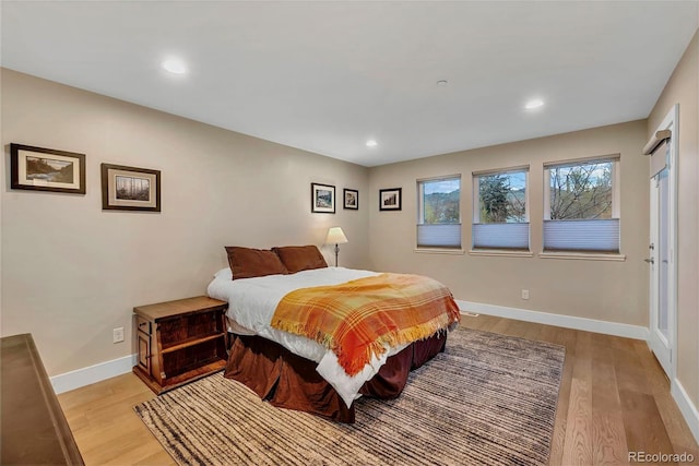 613 Iowa St, Golden, CO 80403 - bedroom with light wood-type flooring, baseboards, and recessed lighting