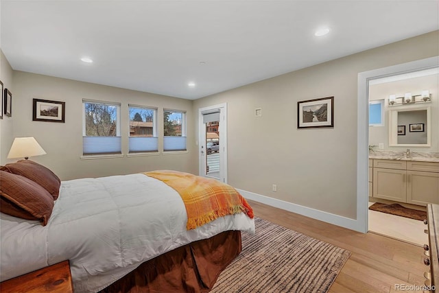 613 Iowa St, Golden, CO 80403 - bedroom with recessed lighting, a sink, light wood-type flooring, baseboards, and ensuite bathroom