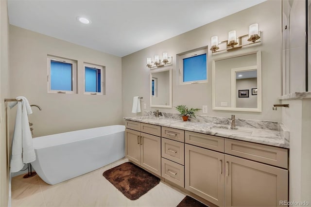 613 Iowa St, Golden, CO 80403 - full bathroom featuring a freestanding bath, a sink, double vanity, and recessed lighting