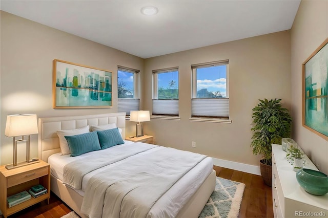 613 Iowa St, Golden, CO 80403 - bedroom featuring baseboards and dark wood-style flooring