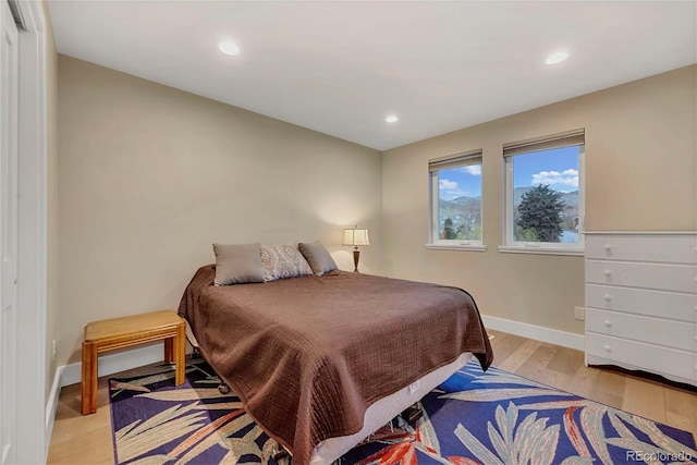 613 Iowa St, Golden, CO 80403 - bedroom featuring recessed lighting, baseboards, and light wood-type flooring