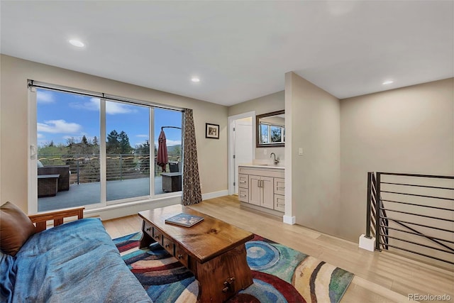 613 Iowa St, Golden, CO 80403 - living area with recessed lighting, light wood-type flooring, and baseboards