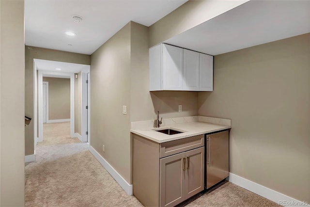 613 Iowa St, Golden, CO 80403 - interior space featuring refrigerator, light carpet, a sink, and baseboards