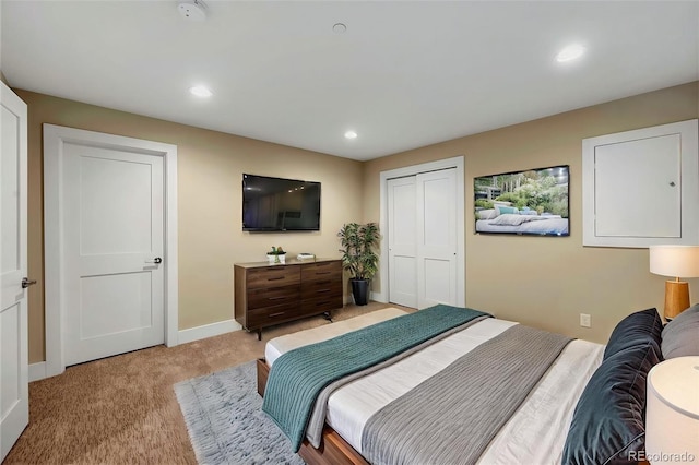 613 Iowa St, Golden, CO 80403 - bedroom featuring light carpet, baseboards, recessed lighting, and a closet