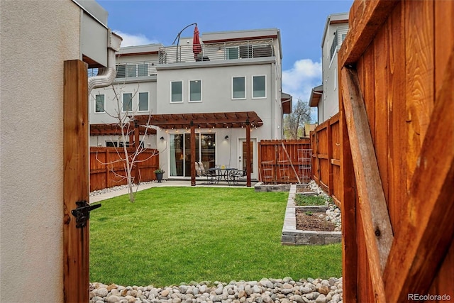 613 Iowa St, Golden, CO 80403 - rear view of property with a pergola, a patio area, a lawn, and a fenced backyard