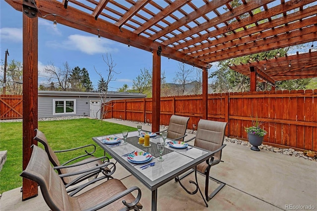 613 Iowa St, Golden, CO 80403 - view of patio / terrace with a pergola, a fenced backyard, an outbuilding, and outdoor dining area