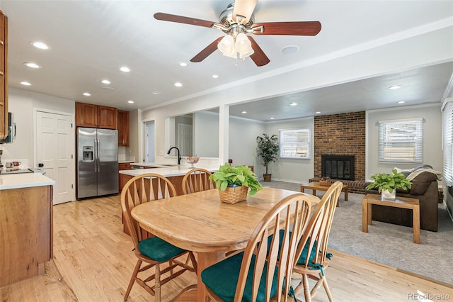 8474 E Otero Cir, Centennial, CO 80112 - dining space featuring plenty of natural light, recessed lighting, crown molding, light wood finished floors, and ceiling fan