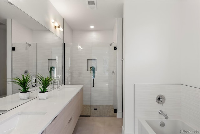 bathroom featuring tile patterned flooring and vanity