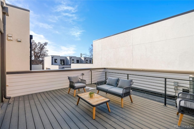 wooden deck featuring outdoor lounge area