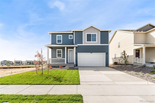 view of front property featuring a garage, central AC, covered porch, and a front lawn