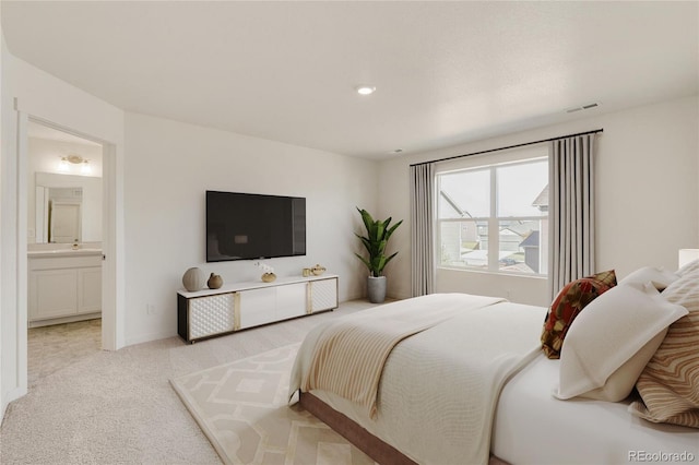 carpeted bedroom featuring ensuite bath