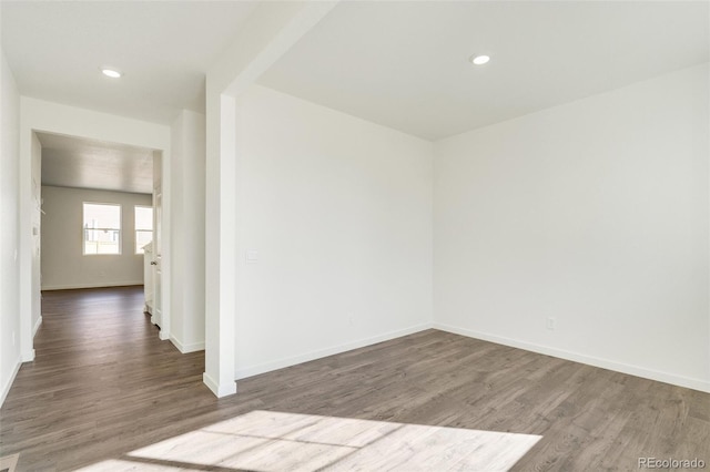 empty room with wood-type flooring