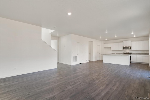 unfurnished living room with dark hardwood / wood-style flooring