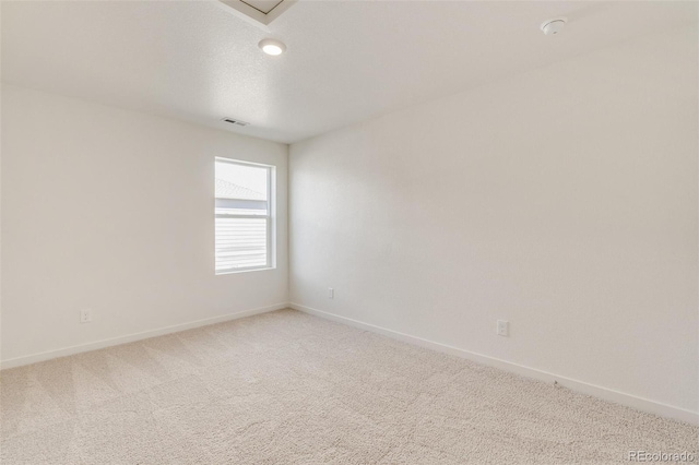 unfurnished room with carpet flooring