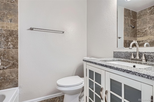 bathroom featuring toilet and vanity