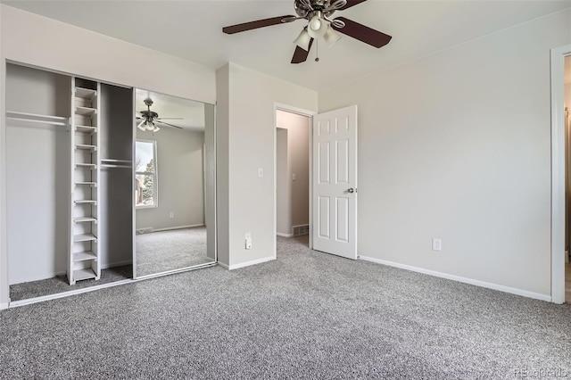 unfurnished bedroom with baseboards, carpet floors, a closet, and ceiling fan