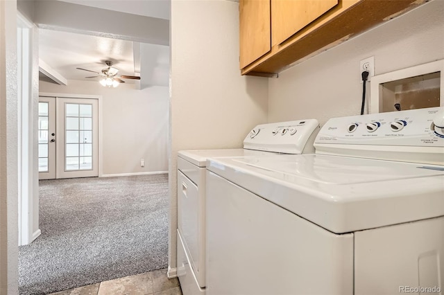 clothes washing area featuring washing machine and dryer, light carpet, a ceiling fan, and cabinet space