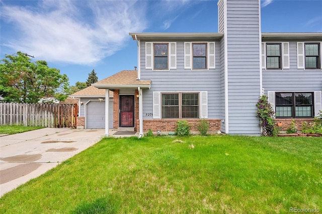 5275 Cody St, Arvada, CO 80002 - view of front facade featuring brick siding, concrete driveway, a garage, and a chimney