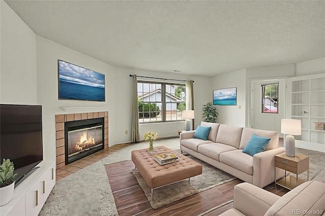 5275 Cody St, Arvada, CO 80002 - living room with plenty of natural light and a tiled fireplace