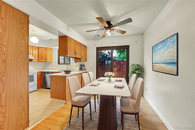5275 Cody St, Arvada, CO 80002 - dining space with a ceiling fan and light wood-style floors