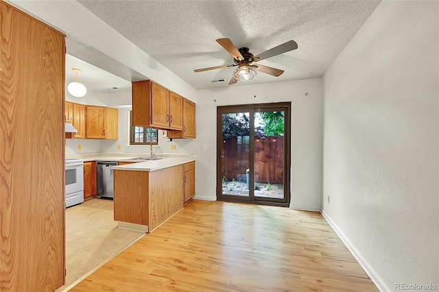 5275 Cody St, Arvada, CO 80002 - kitchen with dishwasher, white range with electric stovetop, a peninsula, a textured ceiling, and brown cabinetry