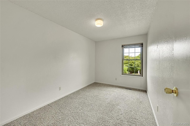 5275 Cody St, Arvada, CO 80002 - carpeted spare room featuring baseboards and a textured ceiling
