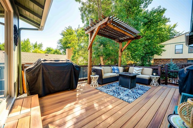 wooden deck featuring a pergola, an outdoor hangout area, and area for grilling