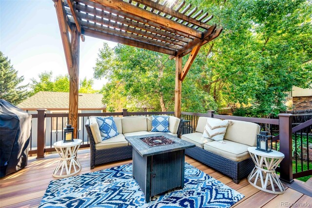 wooden terrace featuring a pergola and an outdoor living space with a fire pit