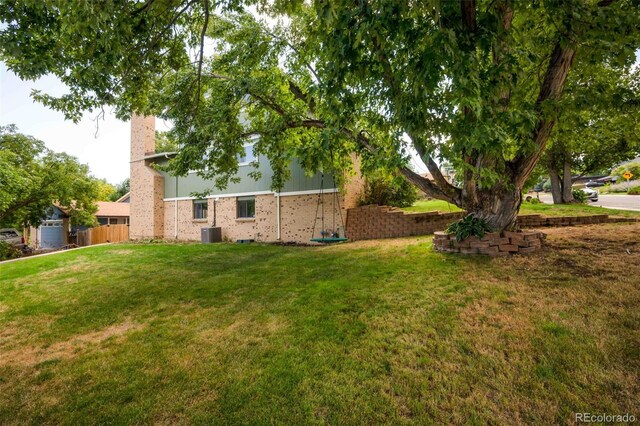 view of yard with central AC