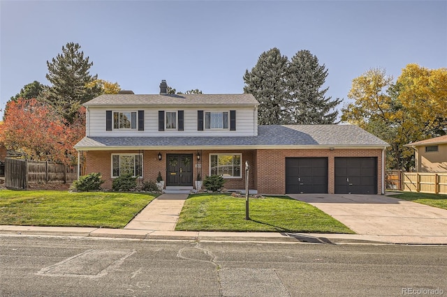 front facade with a front yard, a porch, and a garage