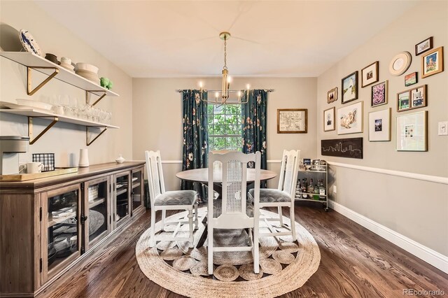 7708 S Krameria Ct, Centennial, CO 80112 - dining room featuring a chandelier, dark wood-style flooring, and baseboards