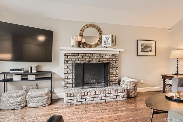 7708 S Krameria Ct, Centennial, CO 80112 - living area featuring baseboards, wood finished floors, and a fireplace