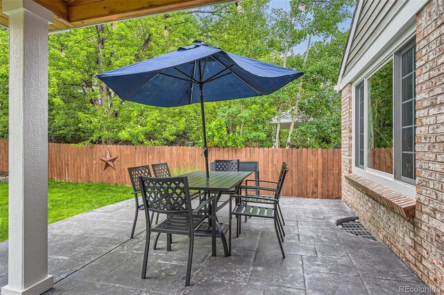 7708 S Krameria Ct, Centennial, CO 80112 - fenced backyard with a patio and outdoor dining area