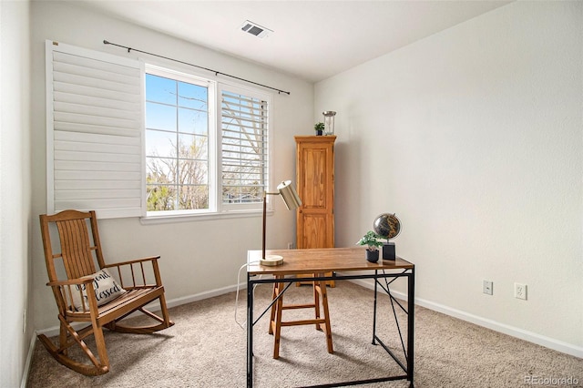 home office with baseboards, a wealth of natural light, carpet, and visible vents