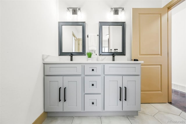 11710 Spruce Canyon Cir, Golden, CO 80403 - bathroom with double vanity, tile patterned flooring, and baseboards