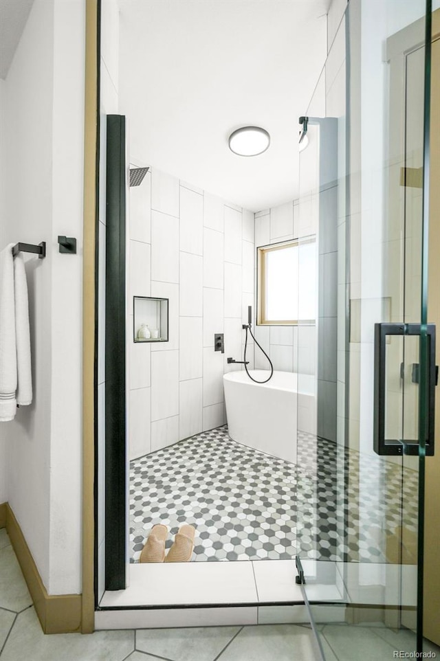 11710 Spruce Canyon Cir, Golden, CO 80403 - full bathroom featuring a shower stall, a freestanding tub, and tile patterned floors