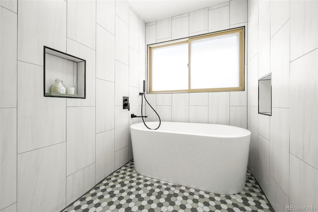 11710 Spruce Canyon Cir, Golden, CO 80403 - bathroom featuring tile walls, a freestanding bath, and tile patterned flooring