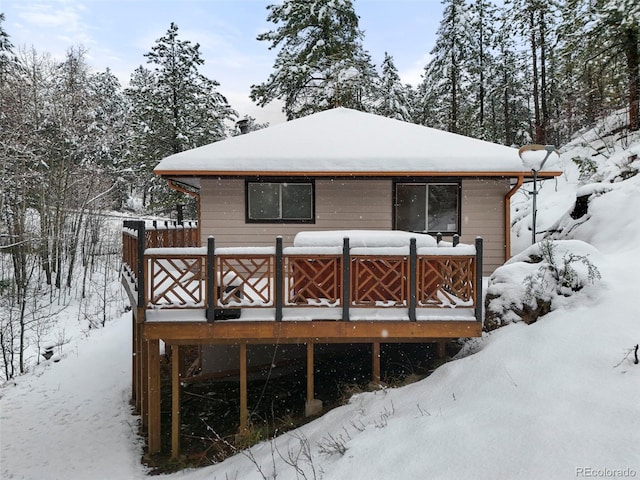 11710 Spruce Canyon Cir, Golden, CO 80403 - snow covered back of property with a wooden deck