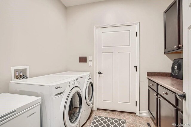 1815 Avery Way, Castle Rock, CO 80109 - clothes washing area with cabinet space and washer and clothes dryer