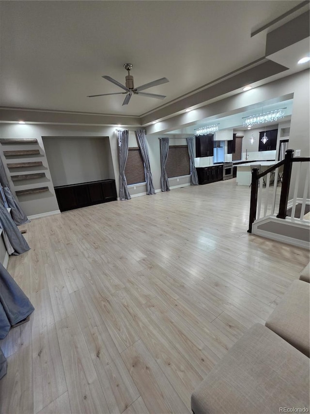 1815 Avery Way, Castle Rock, CO 80109 - unfurnished living room with a ceiling fan, wood finished floors, and stairway