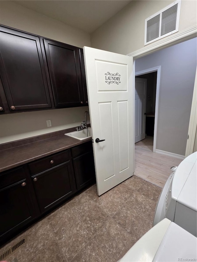 1815 Avery Way, Castle Rock, CO 80109 - clothes washing area with cabinet space and baseboards