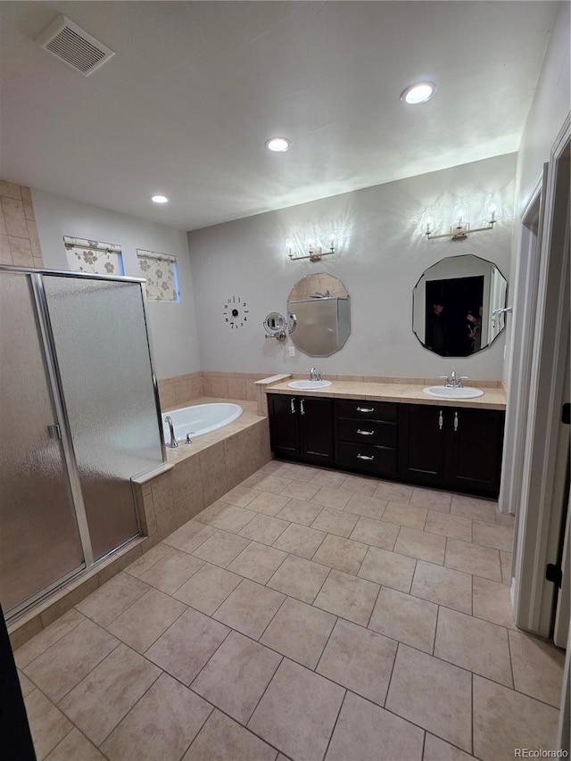 1815 Avery Way, Castle Rock, CO 80109 - bathroom with a shower stall, a bath, double vanity, tile patterned floors, and recessed lighting