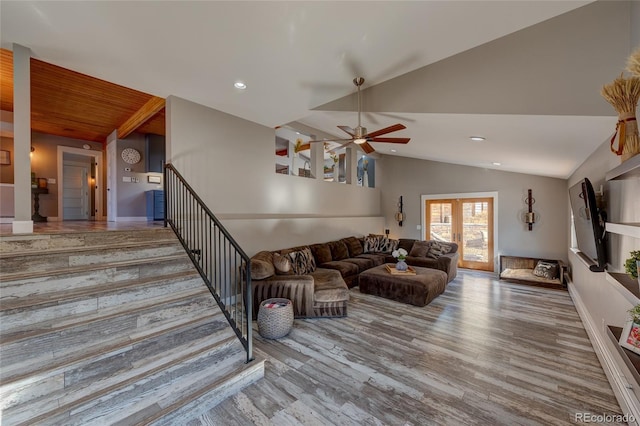 living room with wood-type flooring, ceiling fan, and vaulted ceiling